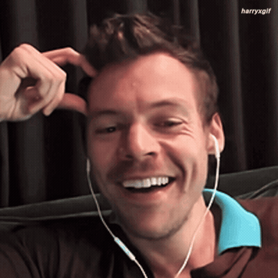 Man In Headphones Smiling And Scratching Head GIF