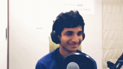 Man In Headphones Smiling At Microphone Lotus App Sign GIF