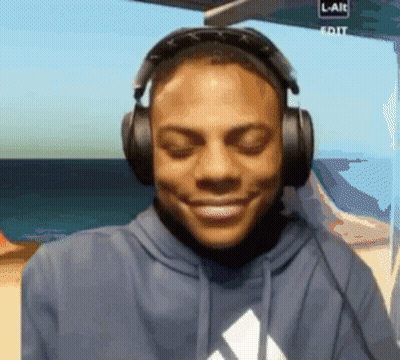Man In Headphones Smiling At Screen Saying L-Aie Edit GIF