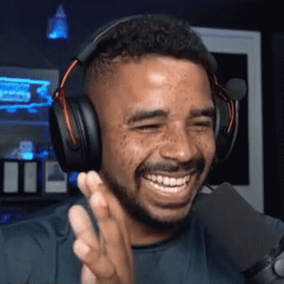 Man In Headphones Smiling Into Microphone GIF