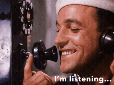 Man In Headphones Smiling Talking On Phone GIF