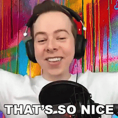 Man In Headphones Standing At Microphone Smiling GIF