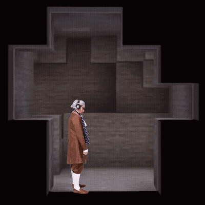 Man In Headphones Standing Before Cross GIF