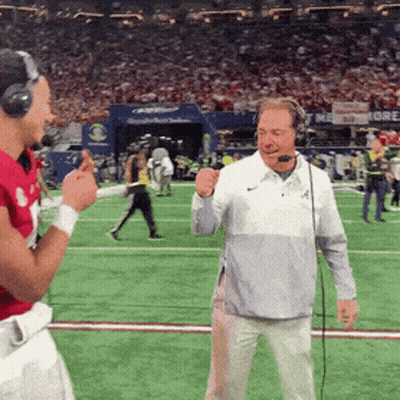 Man In Headphones Talking Into Microphone On Football Field GIF