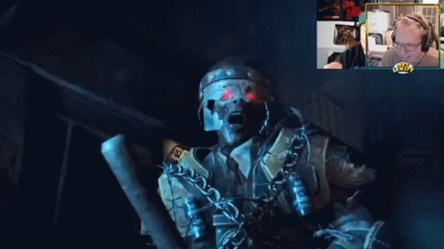 Man In Headphones Watching Skeleton With Chains GIF