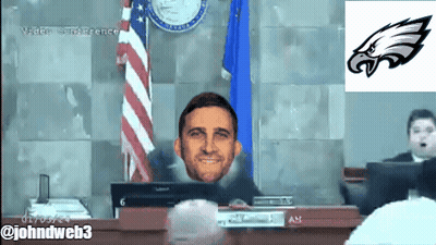 Man In Headphones Watching Vikings Vs Eagles Scoreboard GIF