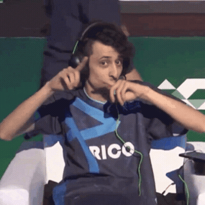 Man In Headphones Wearing Rico Shirt GIF