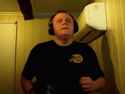 Man In Headphones With Santa Vibes Shirt GIF