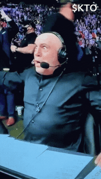Man In Headset In Front Of Crowd Skto GIF