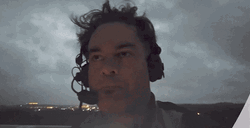 Man In Headset Scared During Thunderstorm GIF