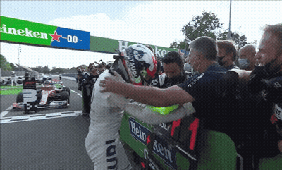 Man In Heineken Shirt Hugging Another Man GIF