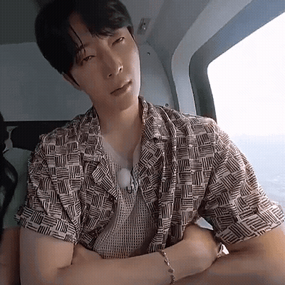 Man In Helicopter Arms Crossed Looking At Camera GIF
