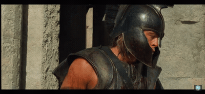 Man In Helmet And Armor At Stone Pillars GIF