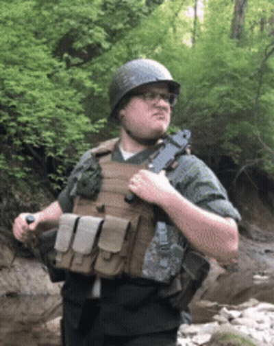 Man In Helmet And Bulletproof Vest Holding Gun GIF