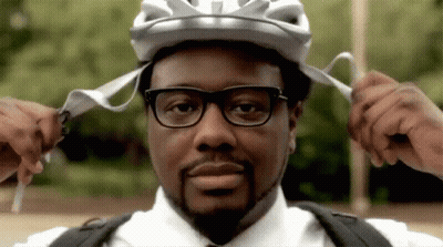 Man in Helmet and Glasses Adjusting Straps