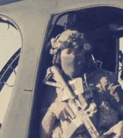 Man In Helmet And Goggles Holding Rifle GIF