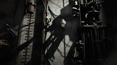 Man In Helmet And Goggles Looking Up At Light GIF