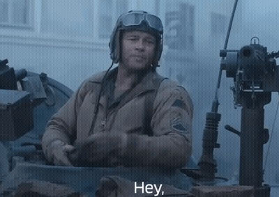 Man In Helmet And Goggles Saying Hey In Tank GIF