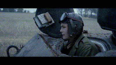 Man In Helmet And Goggles Sitting In Tank GIF