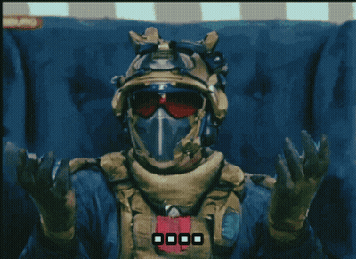 Man In Helmet And Goggles Sitting With Hands Up GIF