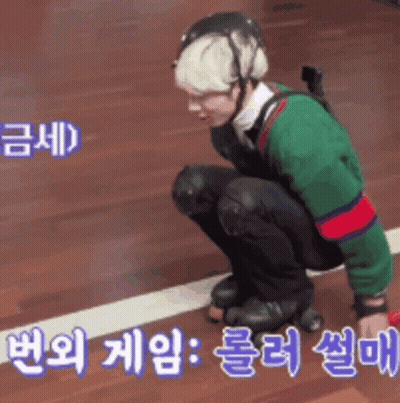 Man In Helmet And Knee Pads Kneeling On Roller Rink GIF