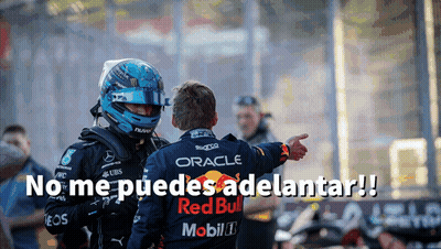 Man In Helmet And Red Bull Shirt Pointing At Another Man GIF