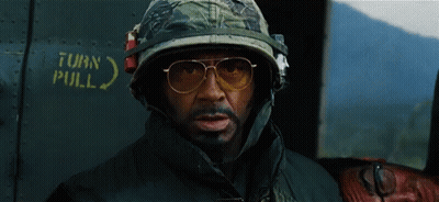 Man In Helmet And Sunglasses In Front Of Turn Pull Sign GIF