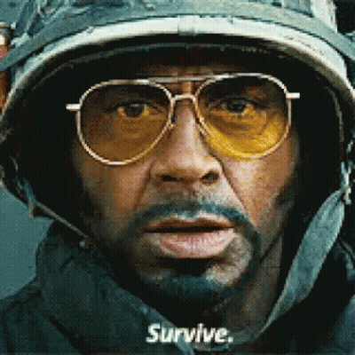Man In Helmet And Sunglasses Says Survive GIF