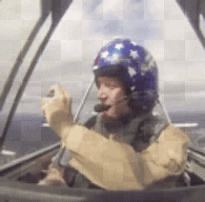 Man In Helmet Driving Plane GIF