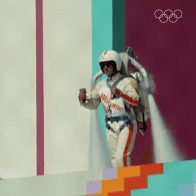 Man In Helmet Flying With Welcome Sign GIF