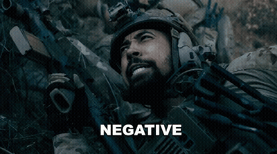 Man In Helmet Holding Gun Saying Negative GIF