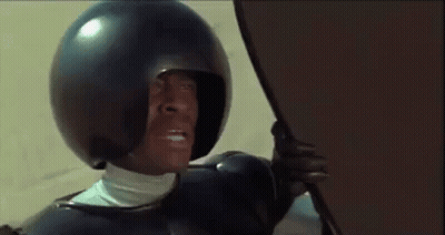 Man In Helmet Holding Shield GIF