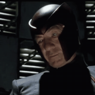 Man In Helmet Looking At Camera GIF
