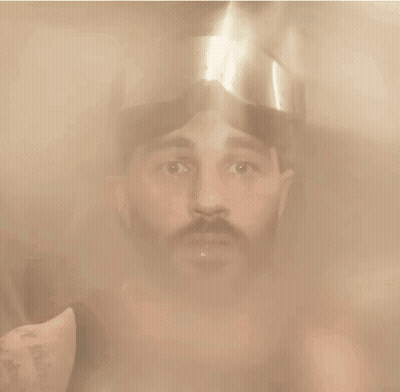 Man In Helmet Looking At Camera GIF