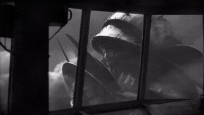 Man In Helmet Looking At Monster GIF