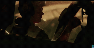 Man In Helmet Looking Out Car Window GIF