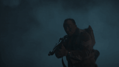 Man In Helmet Next To Man In Sweater GIF