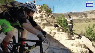 Man In Helmet Riding Bike Down Rocky Trail GIF