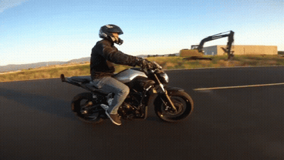 Man In Helmet Riding Motorcycle GIF