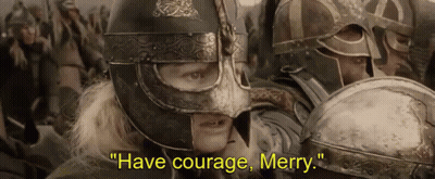 Man In Helmet Says Have Courage Merry To Crowd GIF