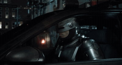 Man In Helmet Sitting In Car Looking Out Window GIF