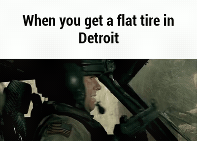 Man In Helmet Sitting In Car With Gun GIF