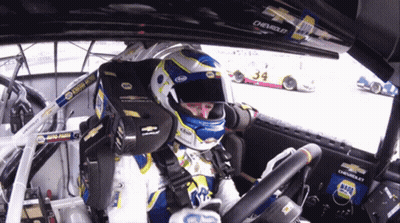 Man In Helmet Sitting In Race Car 34 GIF