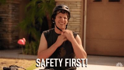 Man In Helmet Smiling Says Safety First GIF