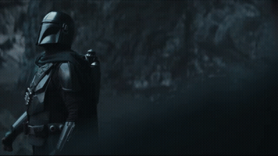 Man In Helmet Standing In Darkness GIF