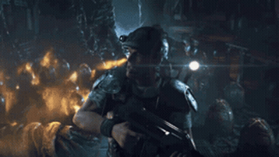 Man In Helmet Stands Before Aliens In Cave GIF