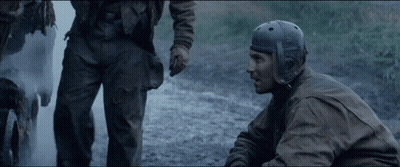 Man In Helmet Talking To Another Man In Field GIF
