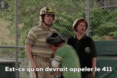 Man In Helmet Talking To Man In Green Shirt GIF
