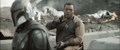 Man In Helmet Talking To Suit GIF