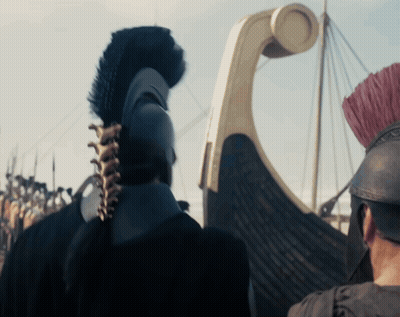 Man In Helmet With Feathered Crest In Front Of Boat GIF